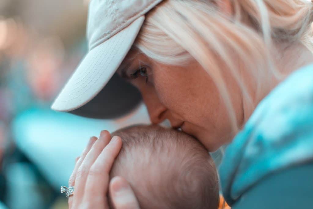 Mom showing supernatural love for her little infant