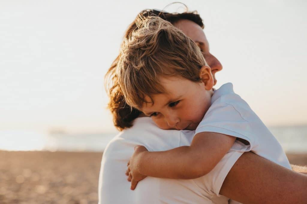 Mother holding child and appreciating the moment