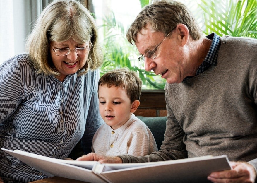 grandparents reading to grandchild