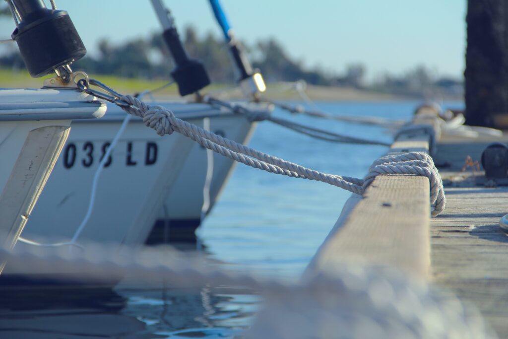 A boat tied to a pier.