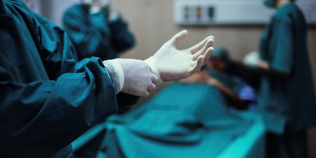 doctors hands putting on gloves