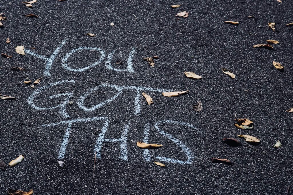 "You got this" written on the ground in chalk
