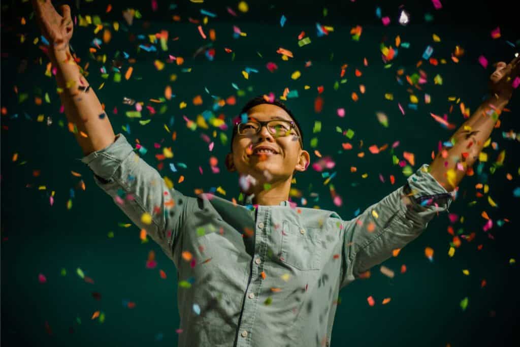 Man celebrating under confetti (1)