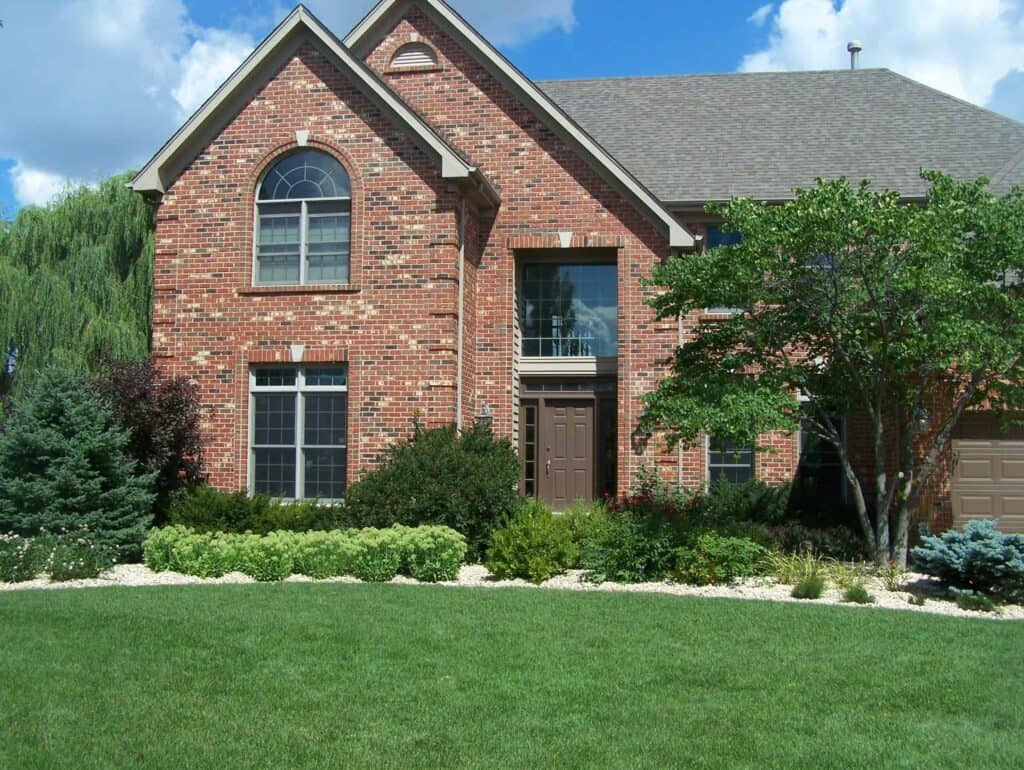 Large brick house in neighborhood
